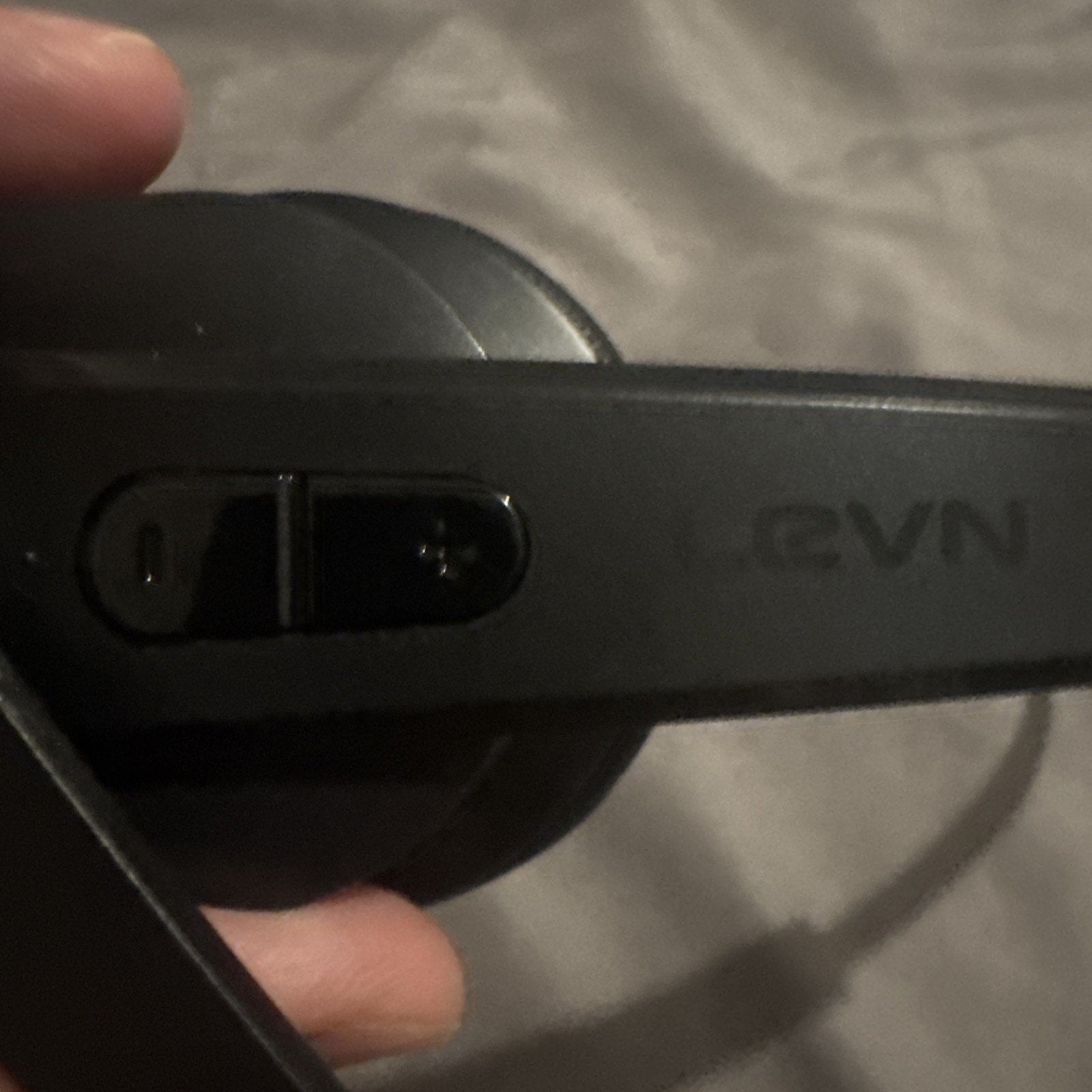 Close-up of LEVN Wireless Bluetooth/USB headset arm featuring volume control and matte black finish design