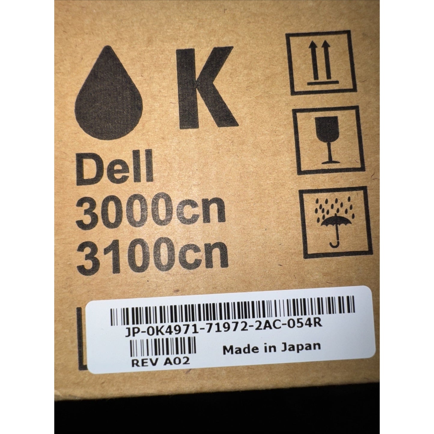 Dell K4971 black toner cartridge box label for 3000cn and 3100cn printers with barcode and handling icons