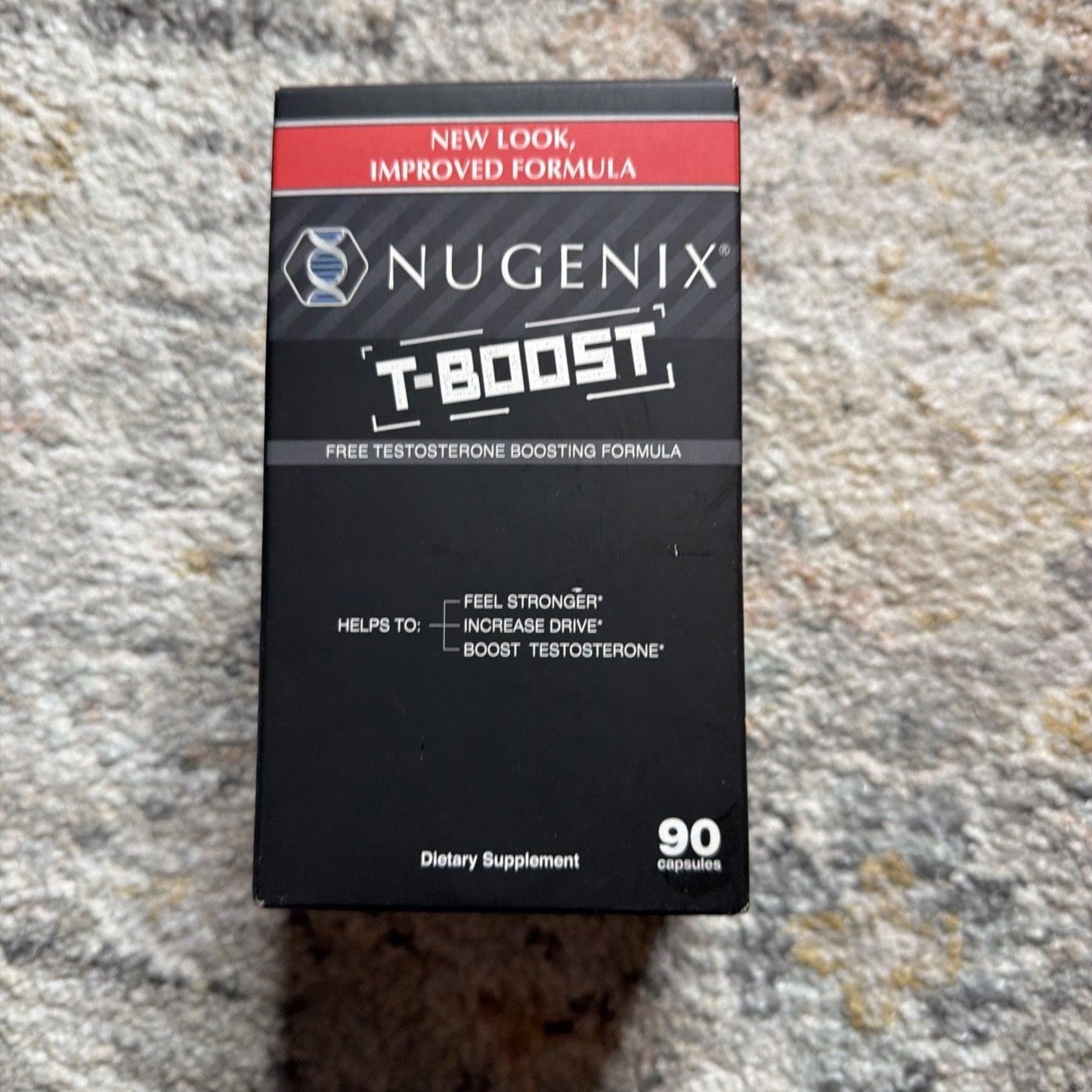 Black and red box of a dietary supplement displaying "Nugenix T-Boost" free testosterone boosting formula with claims to help feel stronger, increase drive, and boost testosterone, containing 90 capsules.