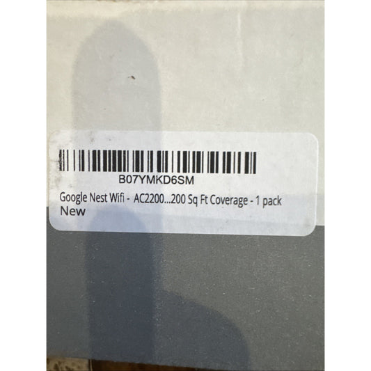 Close-up label on gray box showing Google Nest WiFi AC2200 with 200 sq ft coverage barcode and product details
