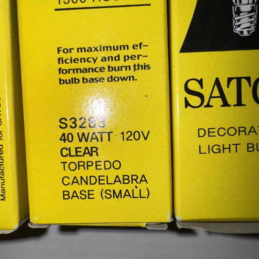 Close-up of yellow SATCO S3283 40 watt 120V clear torpedo candelabra light bulb box with product details text