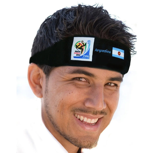 Man smiling and wearing a black headband featuring the 2010 FIFA World Cup South Africa logo, the Argentina flag, and "Argentina" text on a white background.