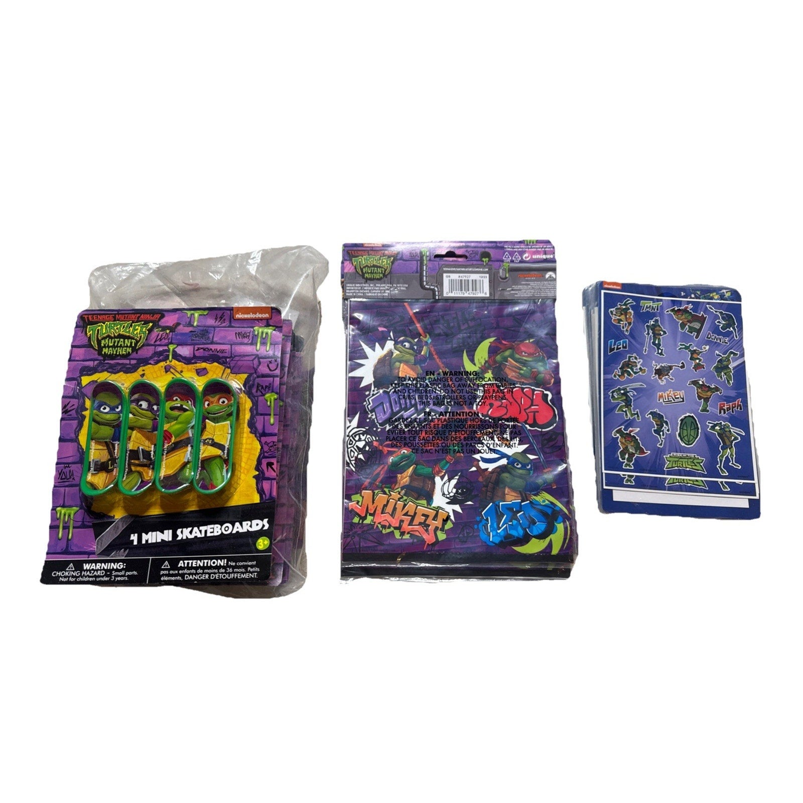 Teenage Mutant Ninja Turtles party favors set with mini skateboards, themed bags, and sticker sheets for kids parties