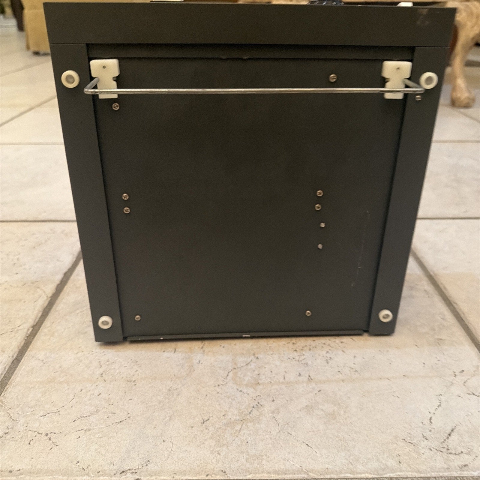 Cybermedics Stenometer cardiology lab instrument showing black metal back panel with screws and mounting bracket