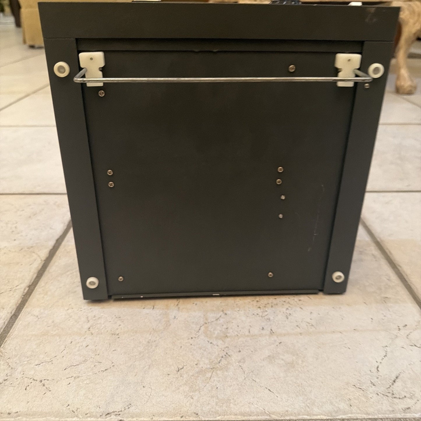 Cybermedics Stenometer cardiology lab instrument showing black metal back panel with screws and mounting bracket