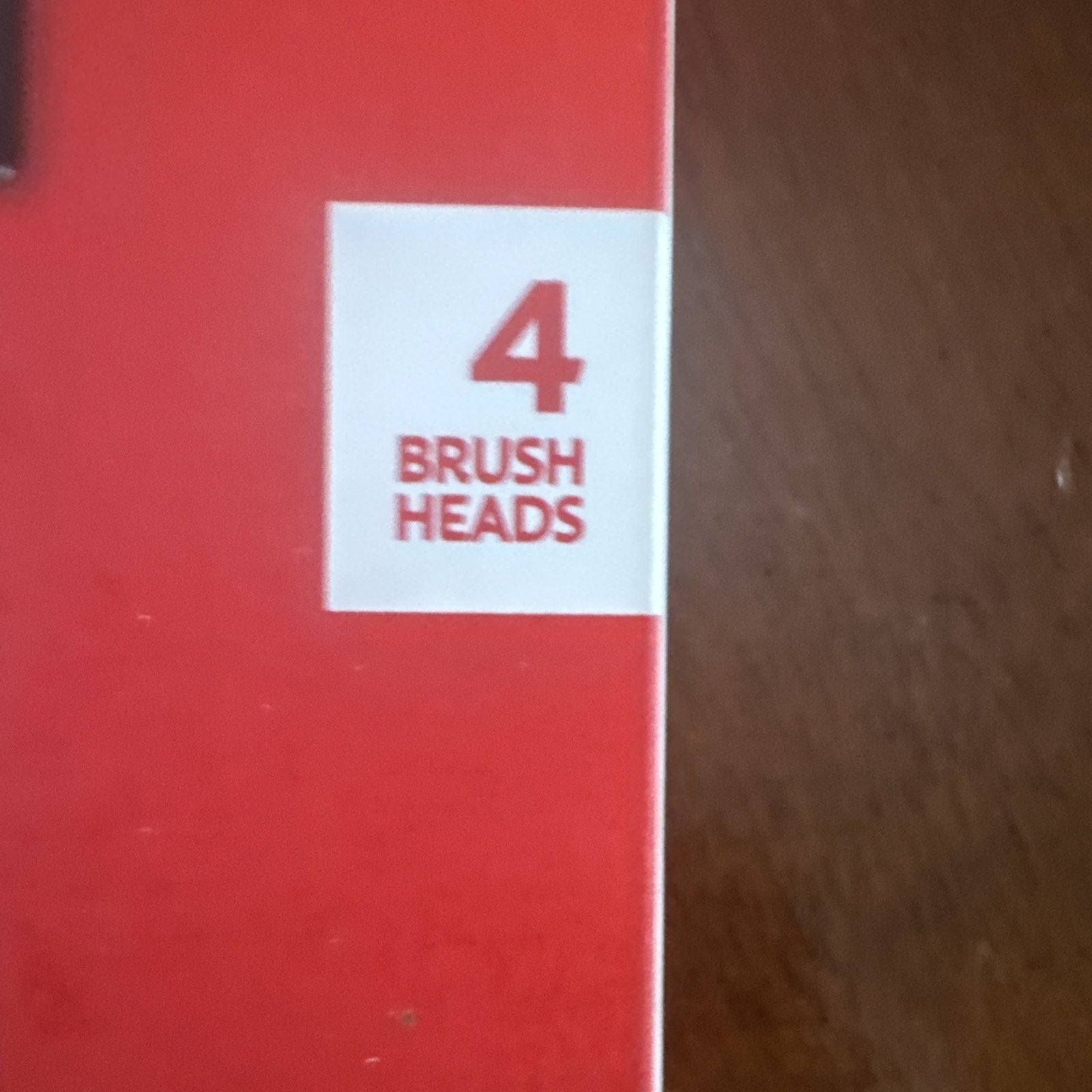 Colgate 360 Floss Tip replaceable toothbrush refill heads package showing quantity of 4 brush heads on red background