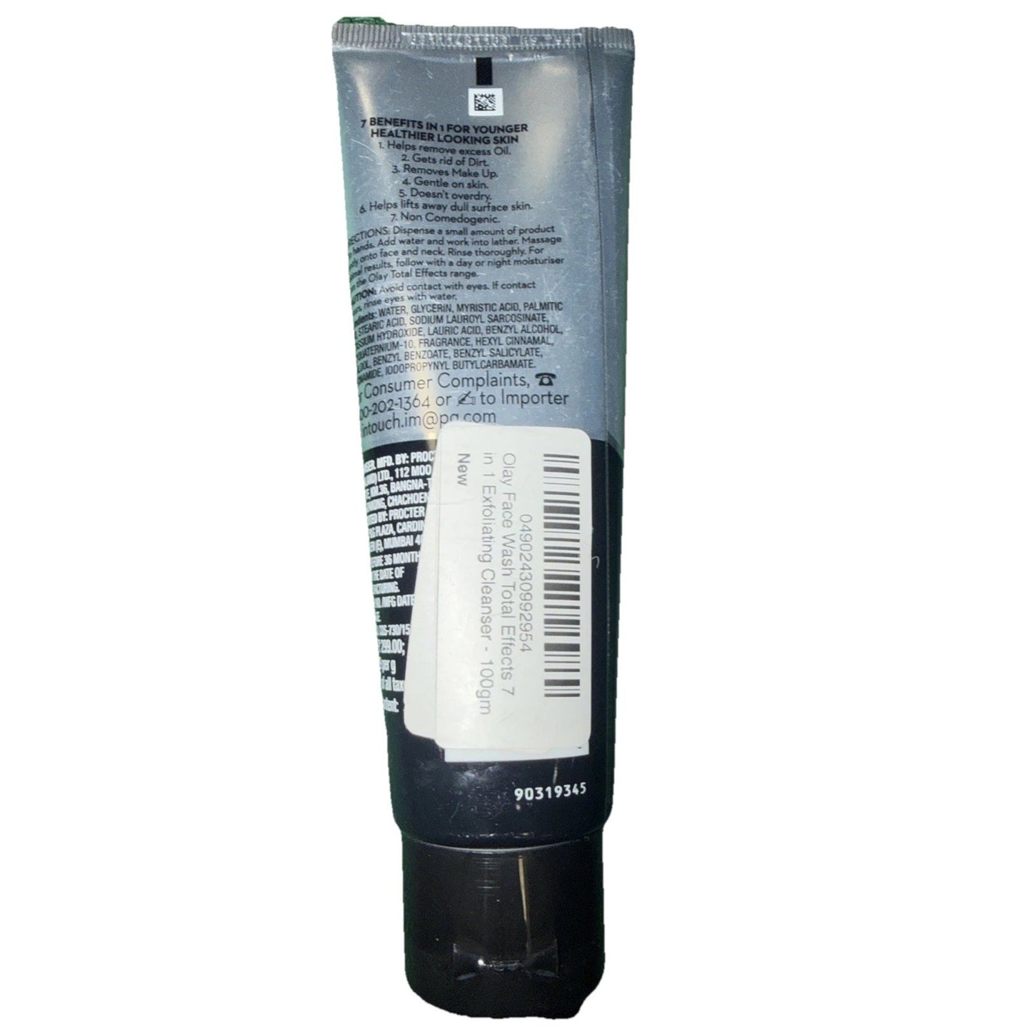 Back view of a black and silver cosmetic tube with a barcode sticker on the lower half, showing printed product information, usage instructions, and safety details.