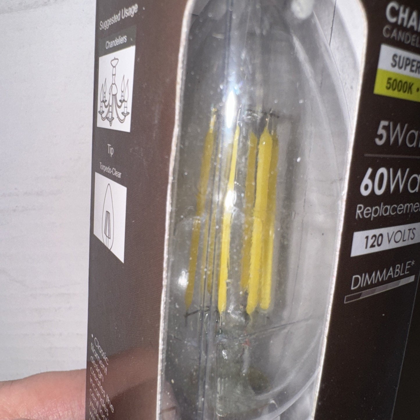 Sunlite LED chandelier bulb 5 watt 120 volts 650 lumens filament style in retail packaging box close-up view