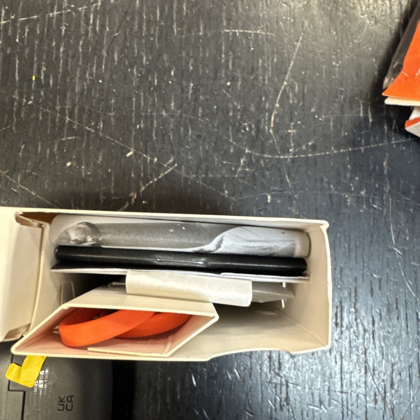 Top view of JBL by Harman Vibe Beam True Wireless Bluetooth Earbuds black packaging with accessories inside box