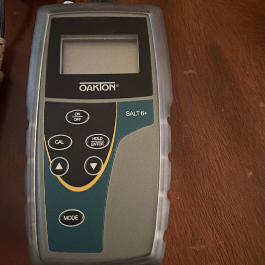 Oakton SALT 6+ Handheld Salinity Meter with buttons and LCD screen for measuring salt concentration