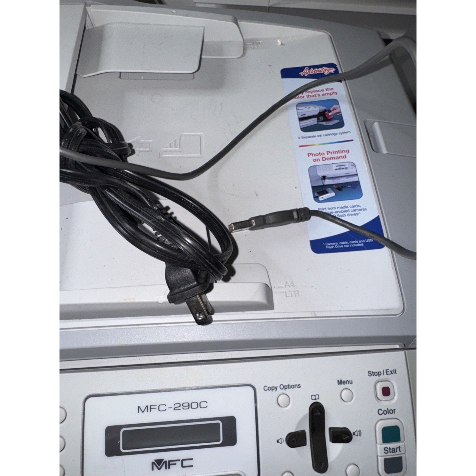 Brother MFC-290C all-in-one inkjet printer top view showing control panel, cords, and photo printing feature sticker