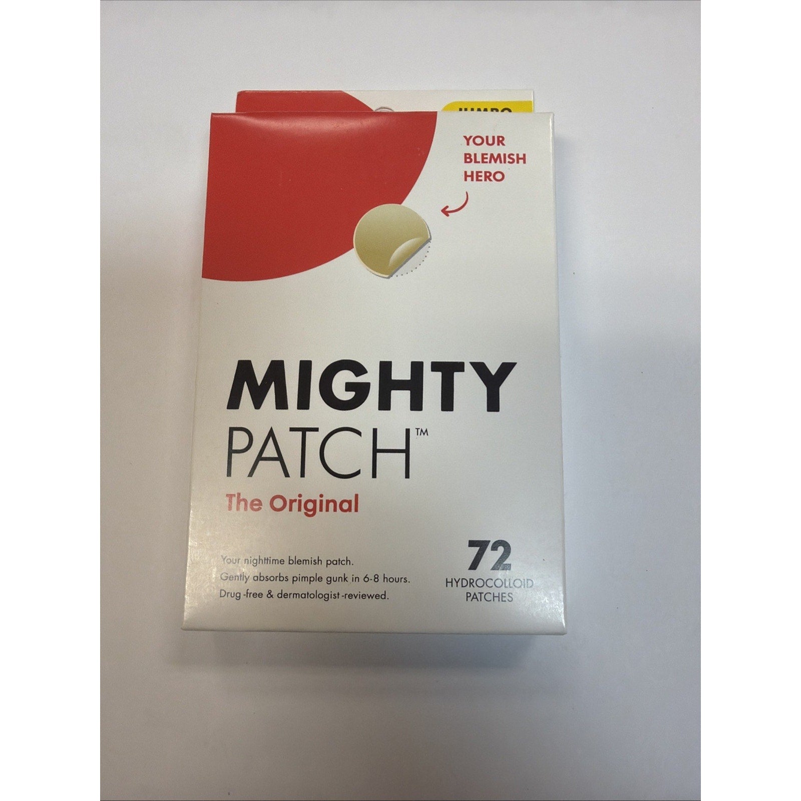 White and red product box labeled "Mighty Patch The Original" featuring a circular hydrocolloid patch illustration and text describing it as a nighttime blemish patch with 72 patches included.