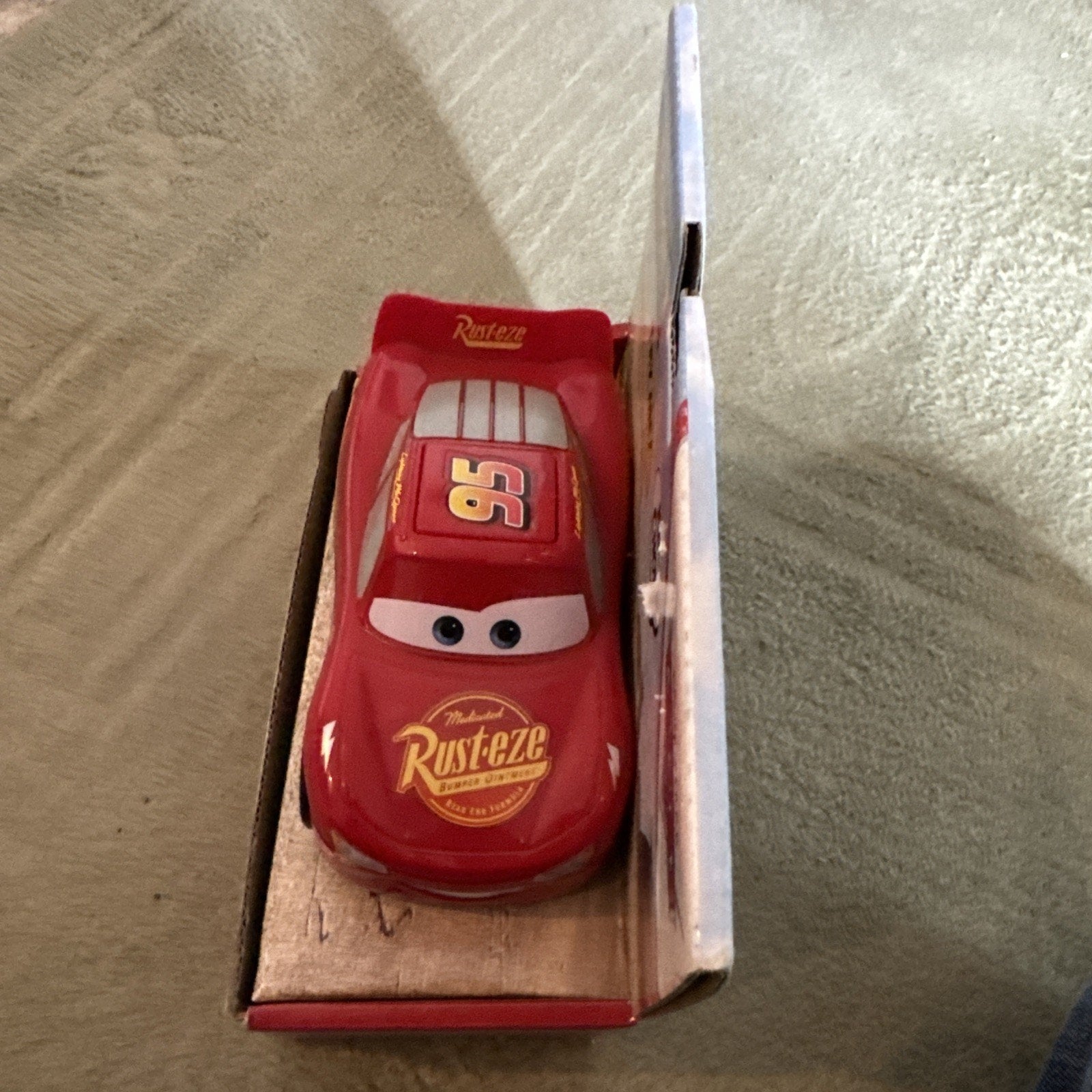 Disney Pixar Cars Track Talkers Lightning McQueen toy car in packaging with Rust-eze logo and number 95 on hood