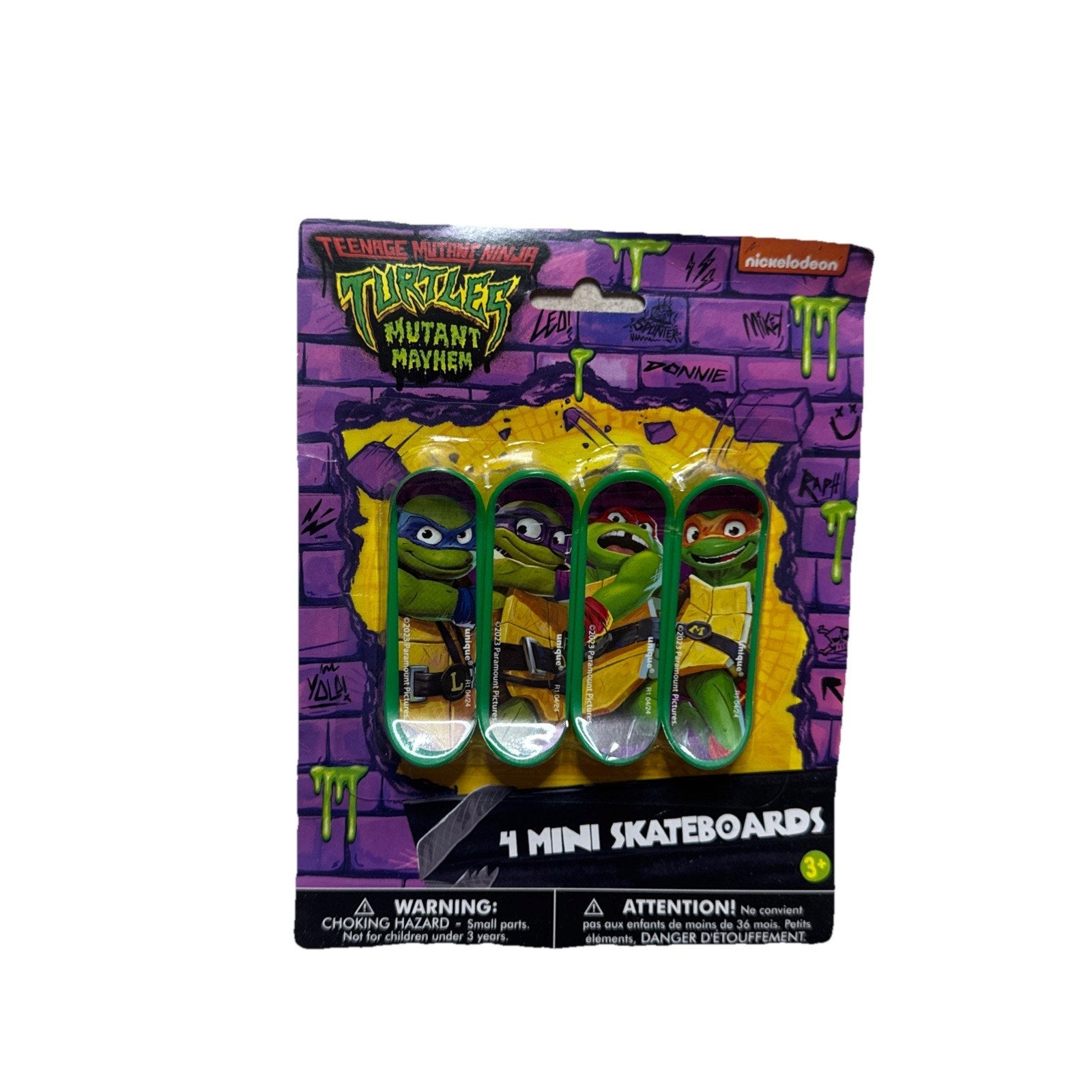 Teenage Mutant Ninja Turtles Mutant Mayhem set of four mini skateboards in purple graffiti style packaging