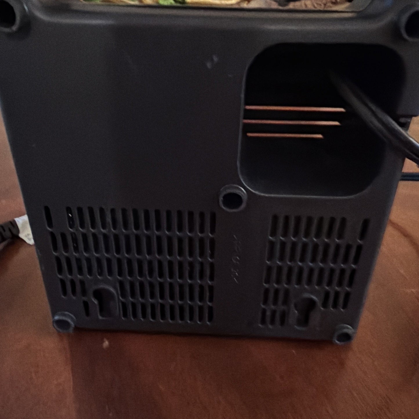 Bottom view of AEG UCR Atlas Copco power tool battery showing ventilation slots and connection ports