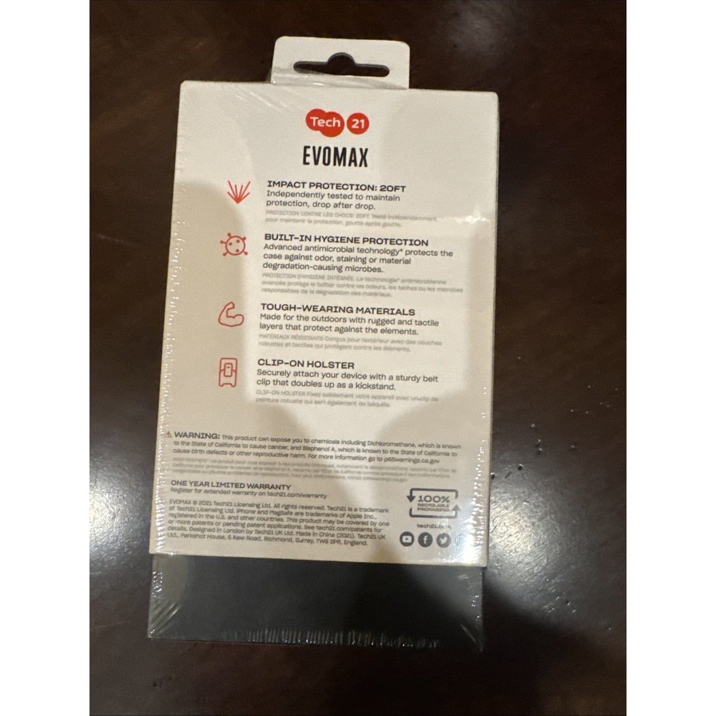 Tech-21 EvoMax iPhone 13 Pro rugged case packaging showing impact, hygiene, material, and holster features in black