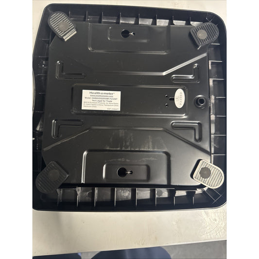 Underside of Health O Meter bathroom scale showing model label and four textured rubber feet