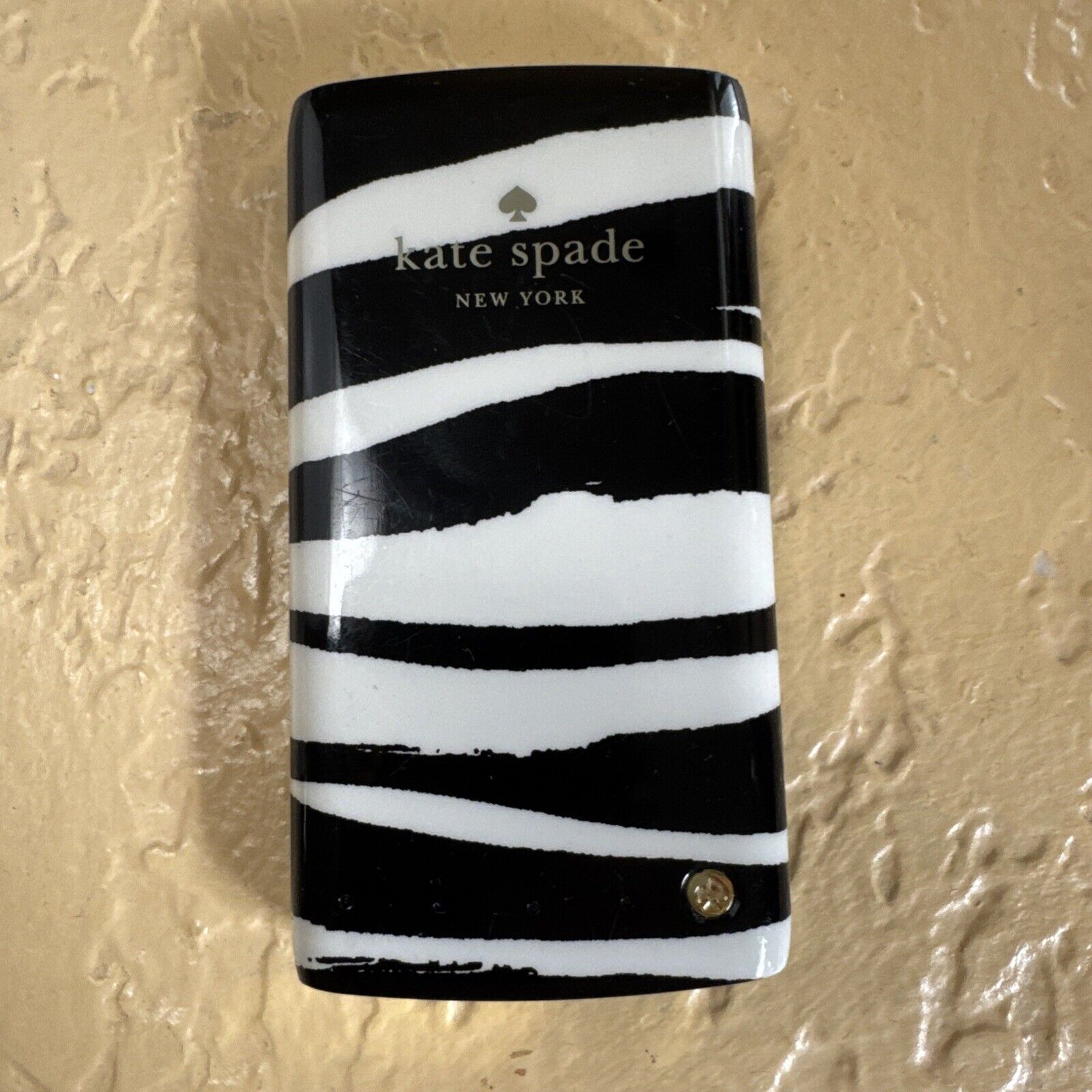 Kate Spade New York black and white striped backup battery bank with 4000mAh capacity for smartphones and tablets