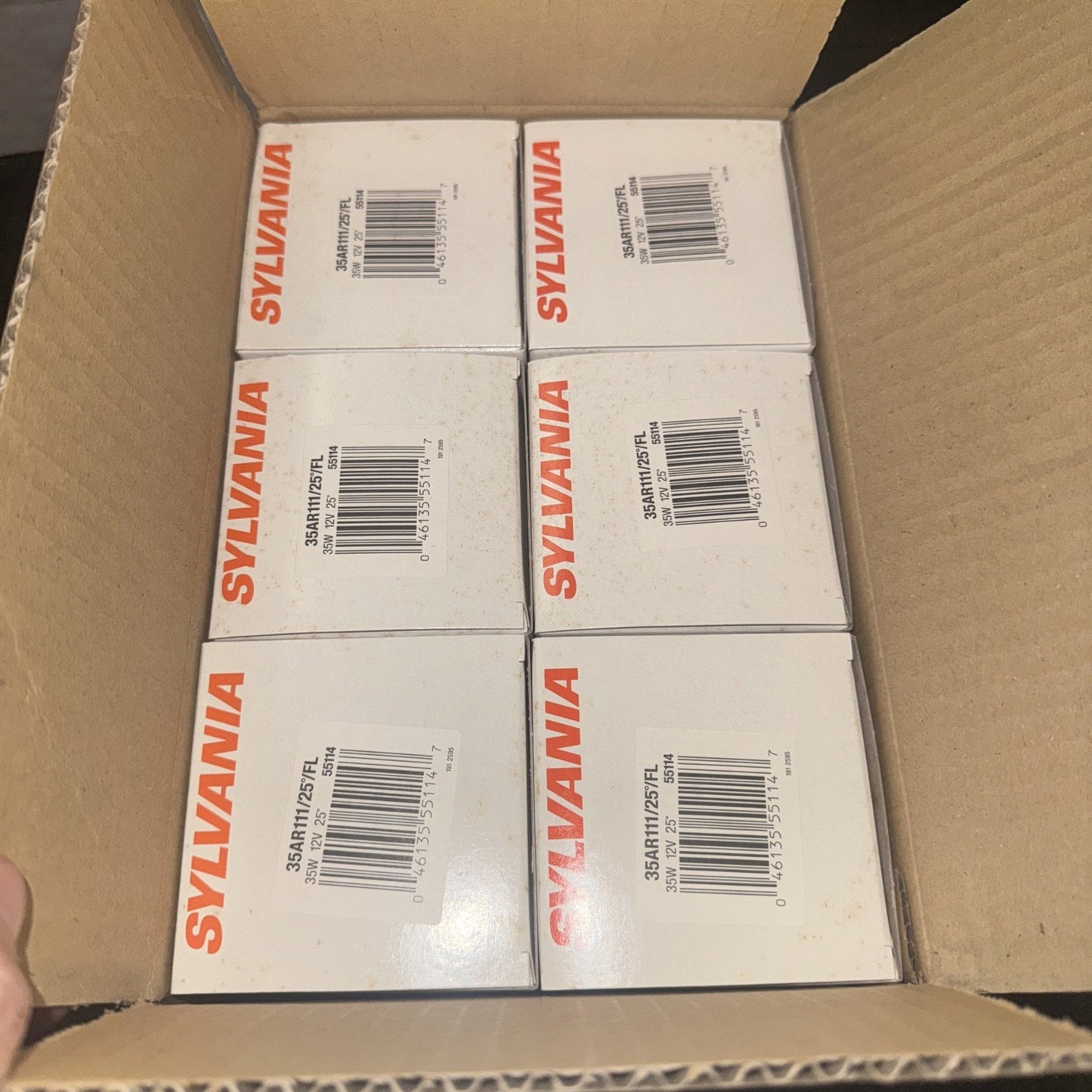 Box of 6 OSRAM SYLVANIA 35W 12V replacement bulbs with barcode visible inside cardboard shipping box