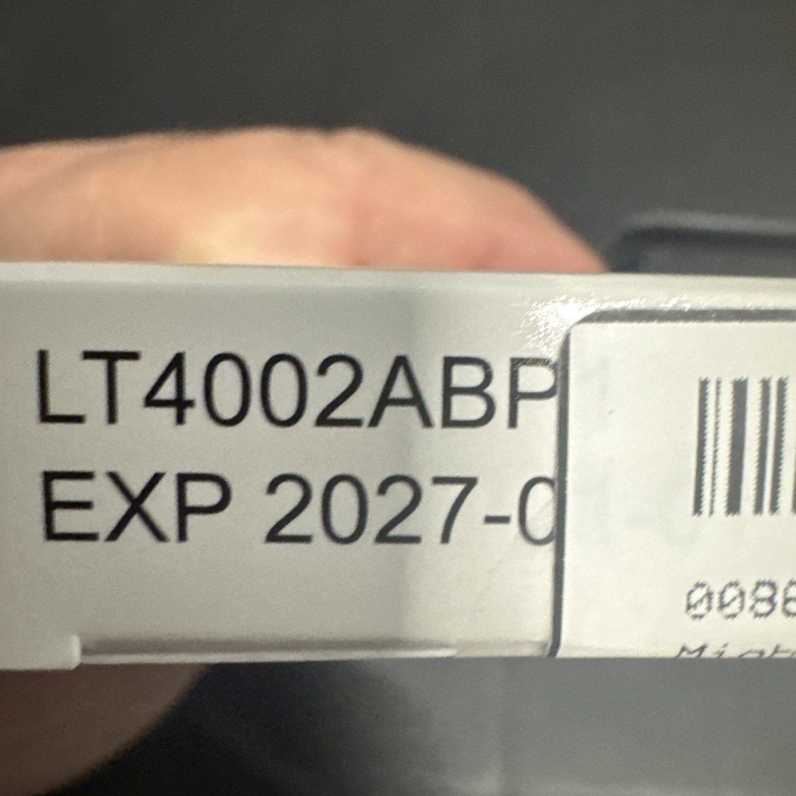 Close-up of NIB Hero Mighty Patch INVISIBLE+ package showing expiration date 01/2027 and product code LT4002ABP