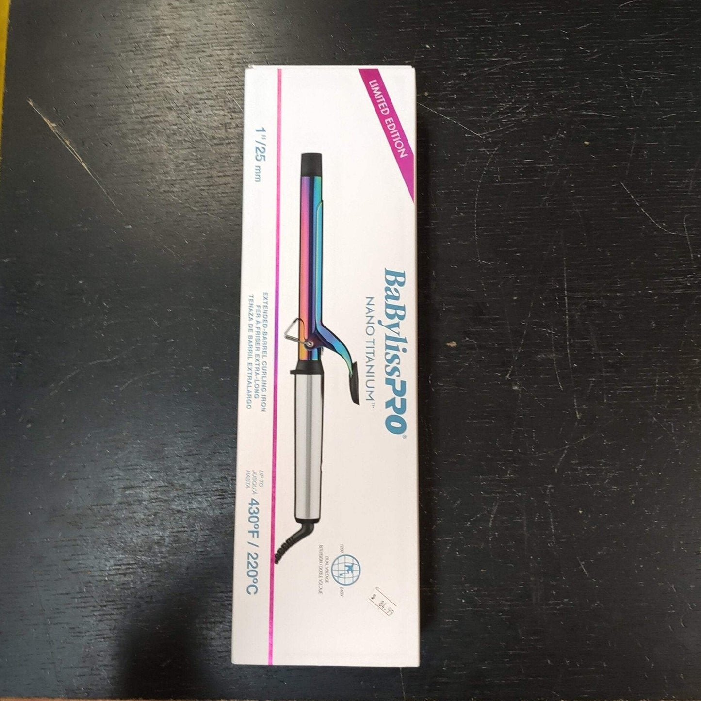 White rectangular box packaging featuring an image of a Babyliss Pro Nano Titanium curling iron with a blue and purple gradient barrel, labeled as a limited edition with heat settings up to 430°F or 220°C.