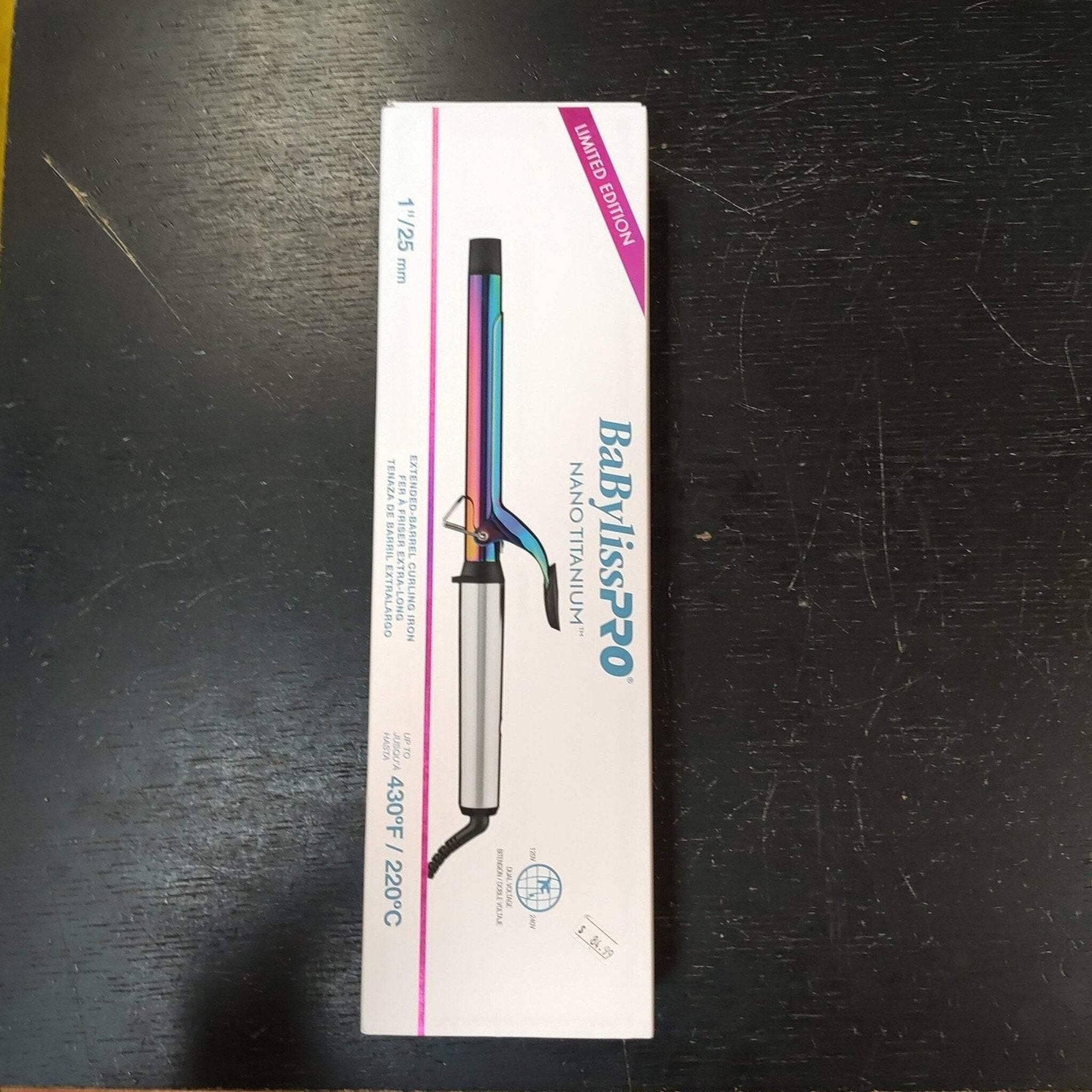 White rectangular box packaging featuring an image of a Babyliss Pro Nano Titanium curling iron with a blue and purple gradient barrel, labeled as a limited edition with heat settings up to 430°F or 220°C.