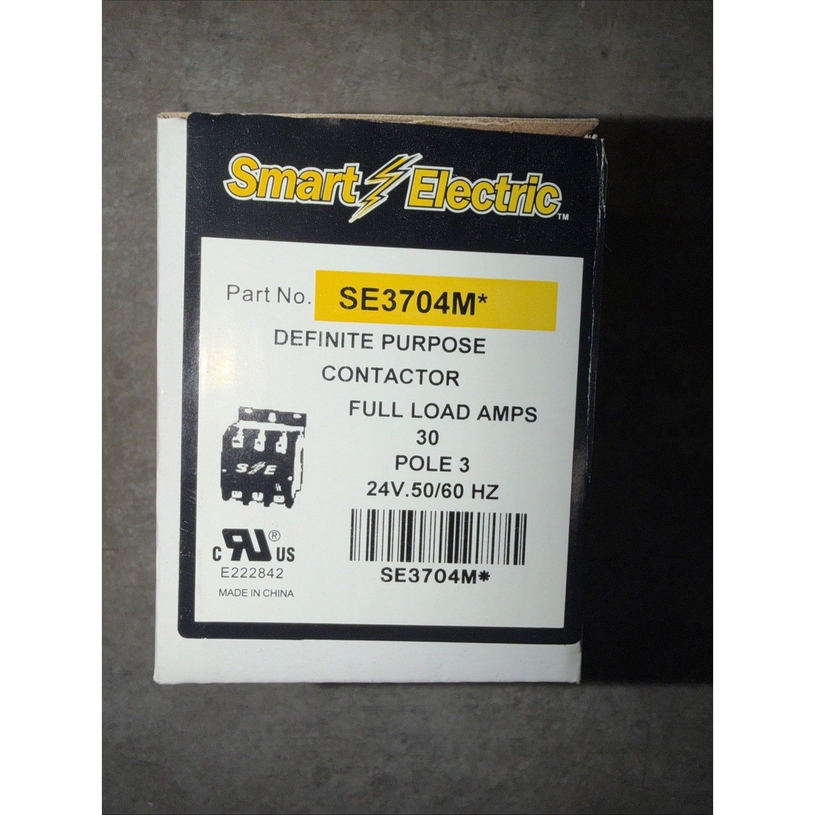 White and black box labeled with the Smart Electric logo and product details including part number SE3704M, definite purpose contactor, 30 full load amps, 3 poles, and 24V 50/60 Hz specifications.