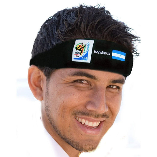 Smiling man wearing a black headband featuring the 2010 FIFA World Cup South Africa logo, the word "Honduras," and the Honduran flag on a white background.
