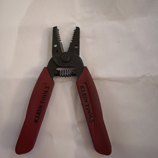 Klein Tools 11046 wire stripper and cutter pliers with red handles designed for cutting and stripping wires