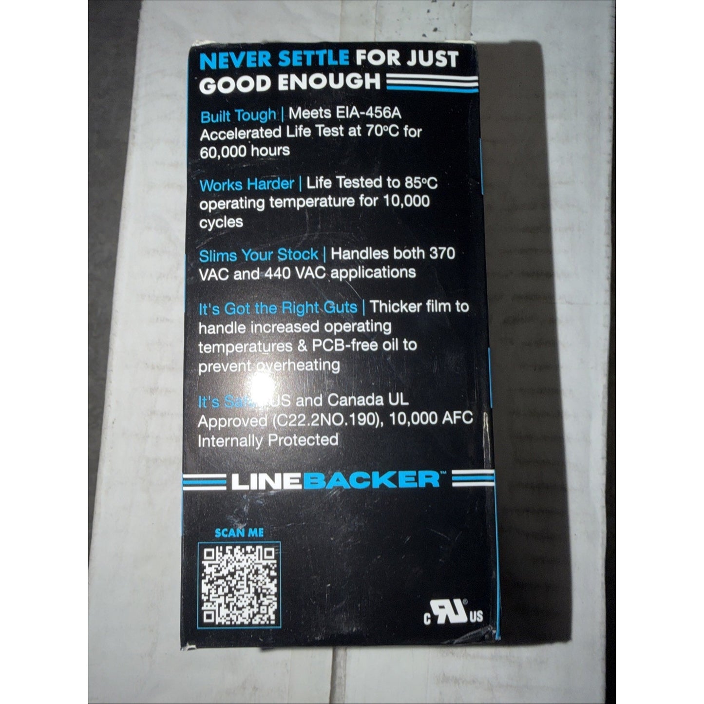 Black product packaging featuring technical specifications about durability, temperature resistance, voltage capacity, and safety approvals, alongside a QR code and certification logos.