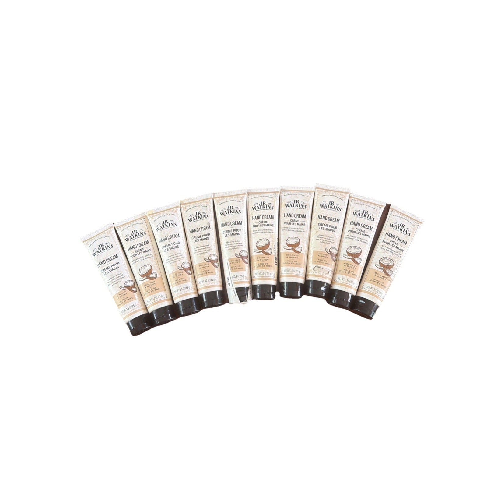 Ten tubes of natural moisturizing hand cream with shea butter arranged in a fan shape on a white background