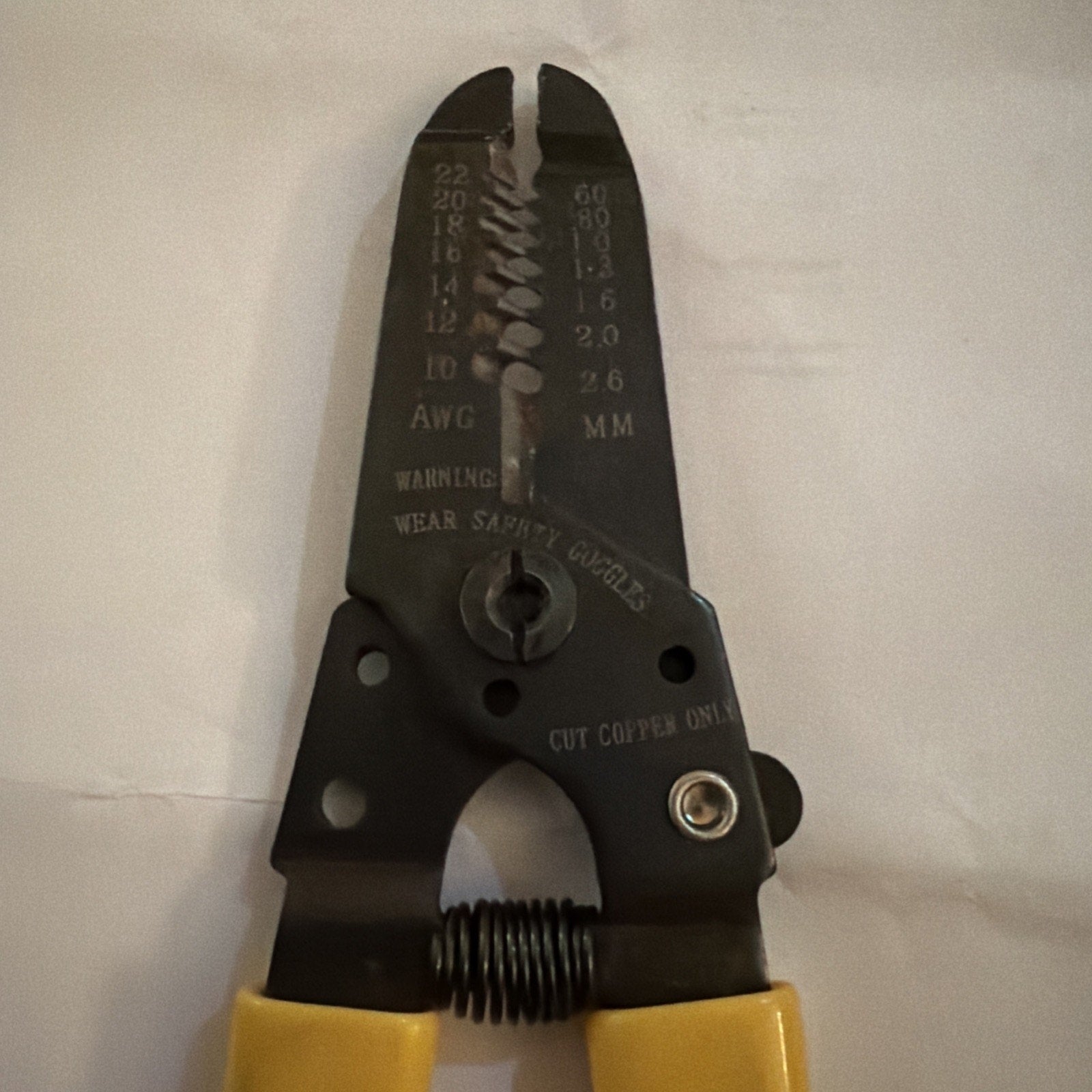 Jonard JIC-1022 wire stripper cutter showing black metal head with wire gauge markings and yellow handles