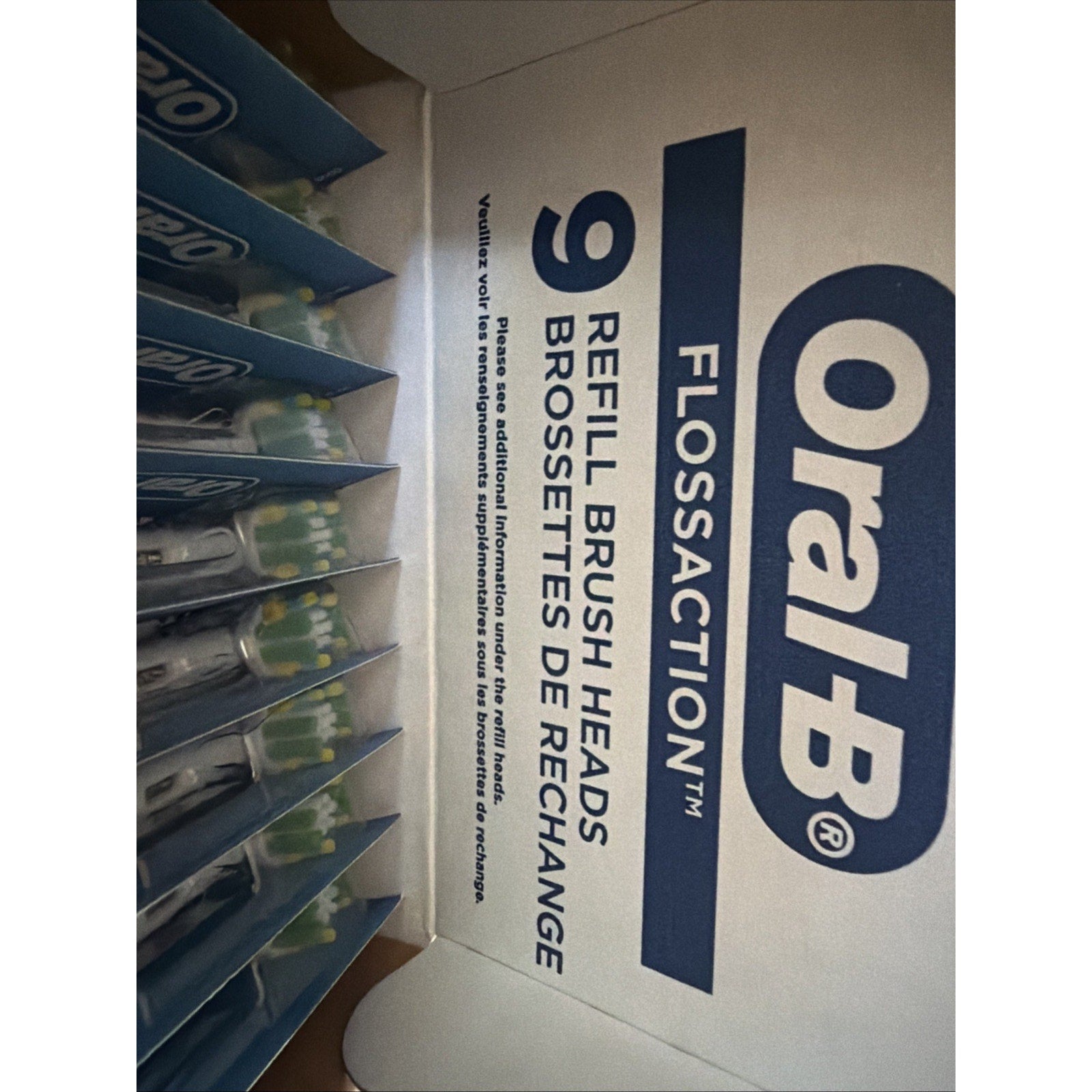 Oral-B FlossAction X electric toothbrush replacement brush heads 9 count packaged with visible brush heads inside box