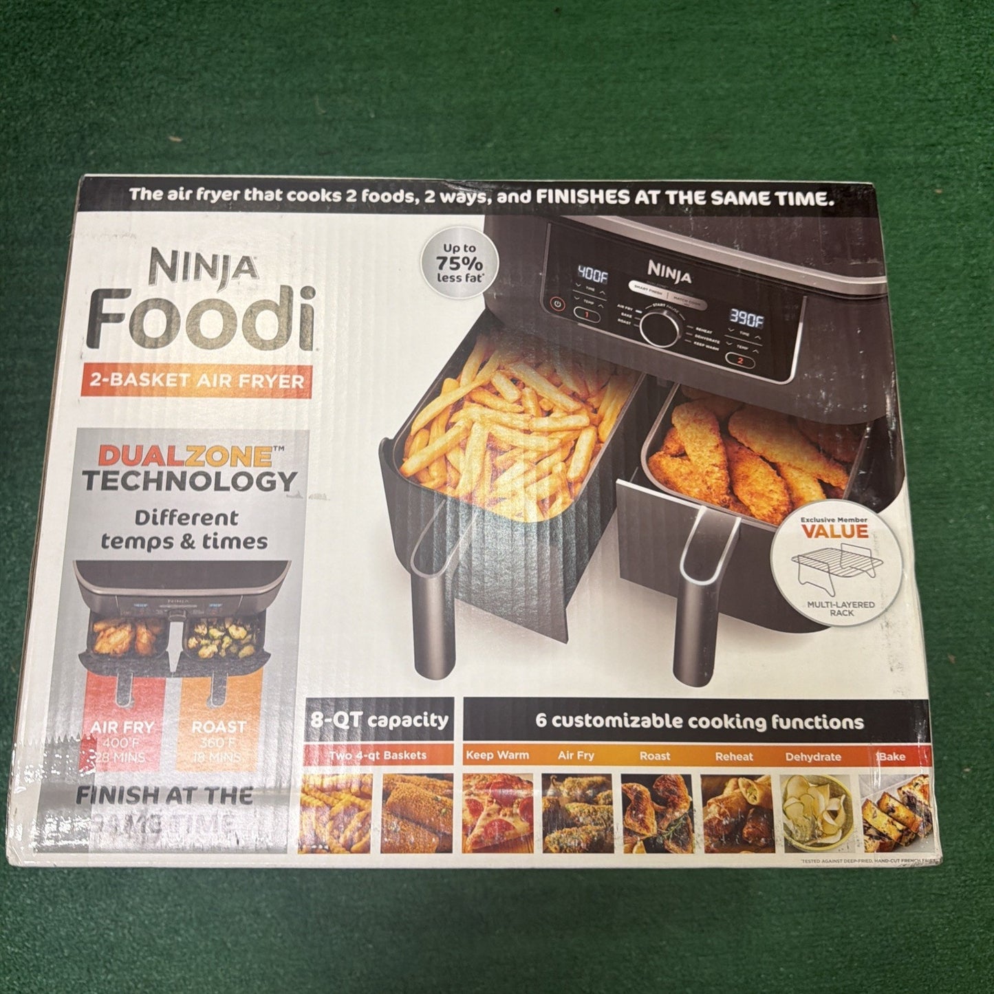 White rectangular box of a Ninja Foodi 2-basket air fryer showing dual cooking baskets with French fries and chicken, highlighting dual zone technology, 8-quart capacity, and six cooking functions.