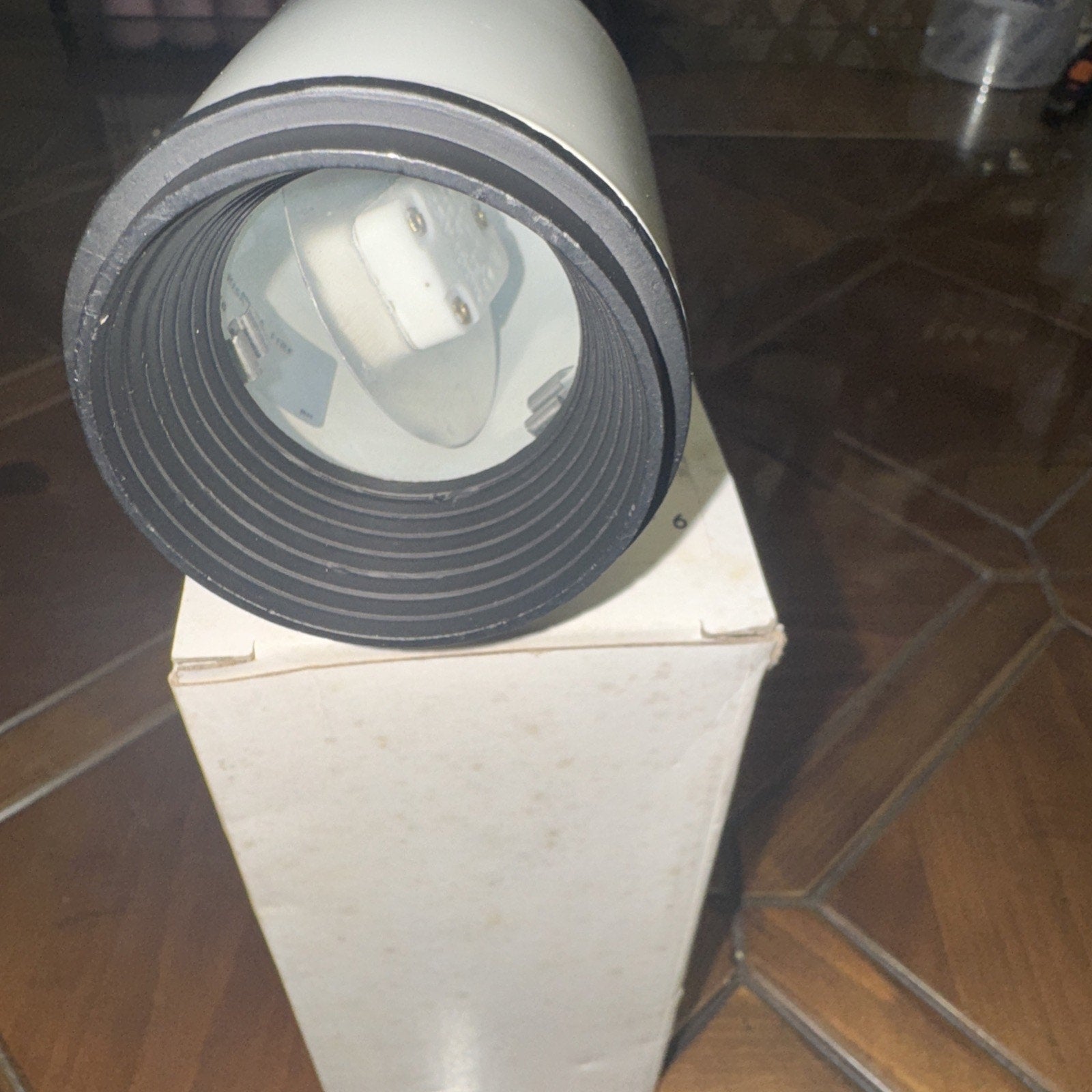 7545-WH White Track Light Head Fixture Spotlight Lamp with H-style connector shown resting on box at an angle