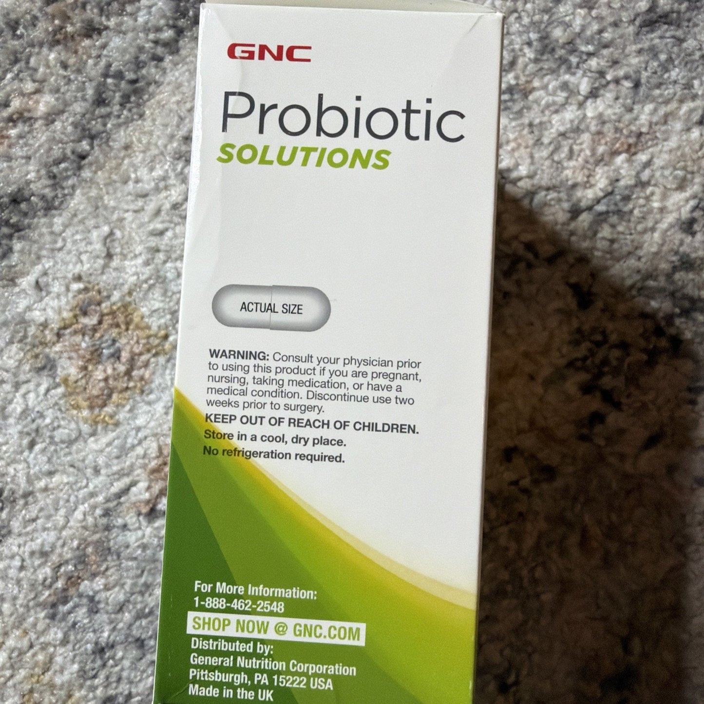 Side view of GNC Probiotic Solutions box showing dosage warning, storage instructions to keep out of reach of children and store in a cool dry place without refrigeration.