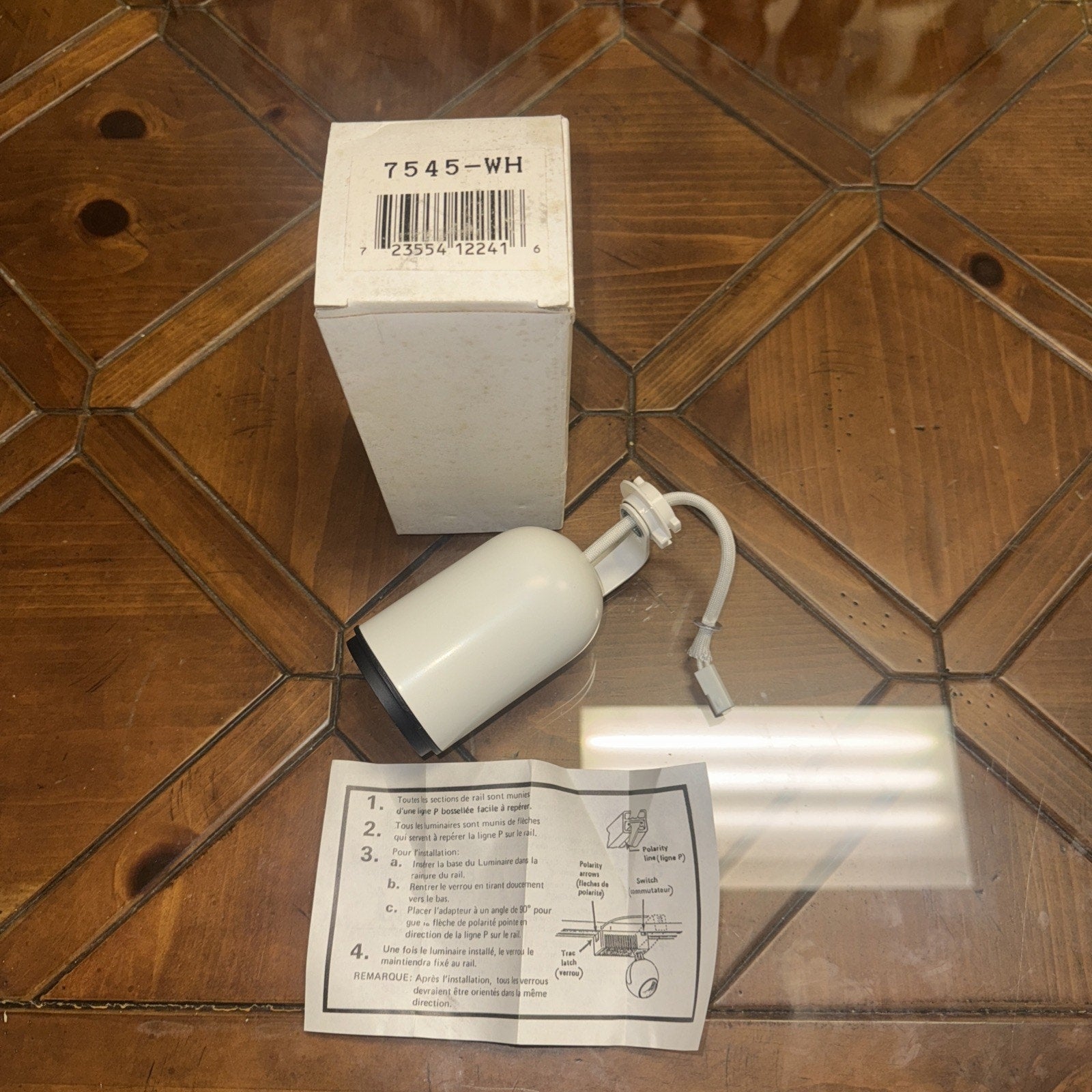7545-WH white track light head fixture spotlight lamp with H-style connector and instruction sheet on wooden floor