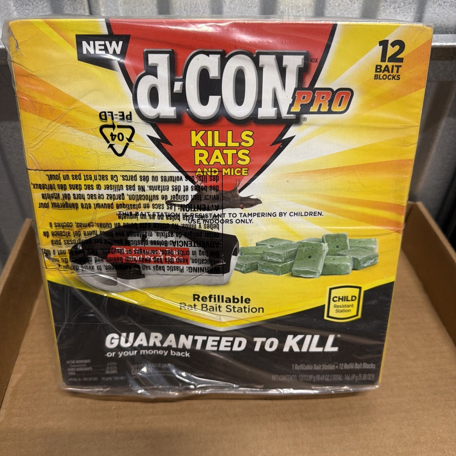 Box of d-CON Pro rat bait station featuring 12 green bait blocks with a yellow and black design, labeled as refillable and child-resistant, guaranteed to kill rats and mice.