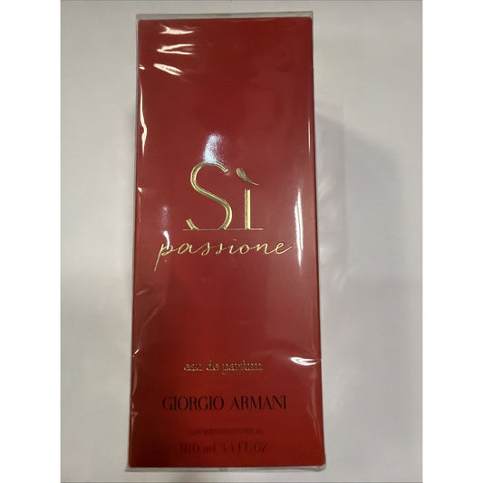 Rectangular bottle packaging in deep red with glossy finish, featuring gold embossed "Sì passione" text and Giorgio Armani branding near the bottom.