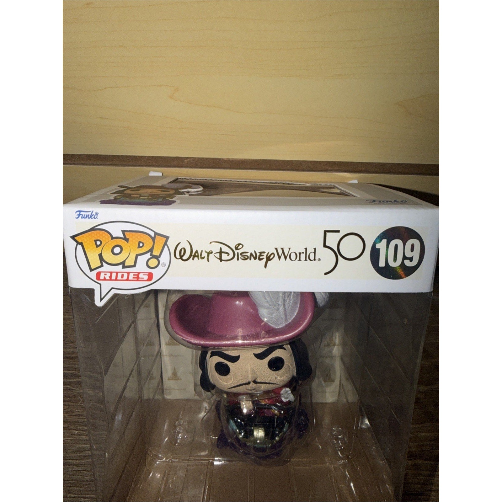 Funko Pop! Rides figure of Captain Hook from Walt Disney World's Peter Pan's Flight attraction, displayed inside clear collectible packaging with 50th anniversary branding.