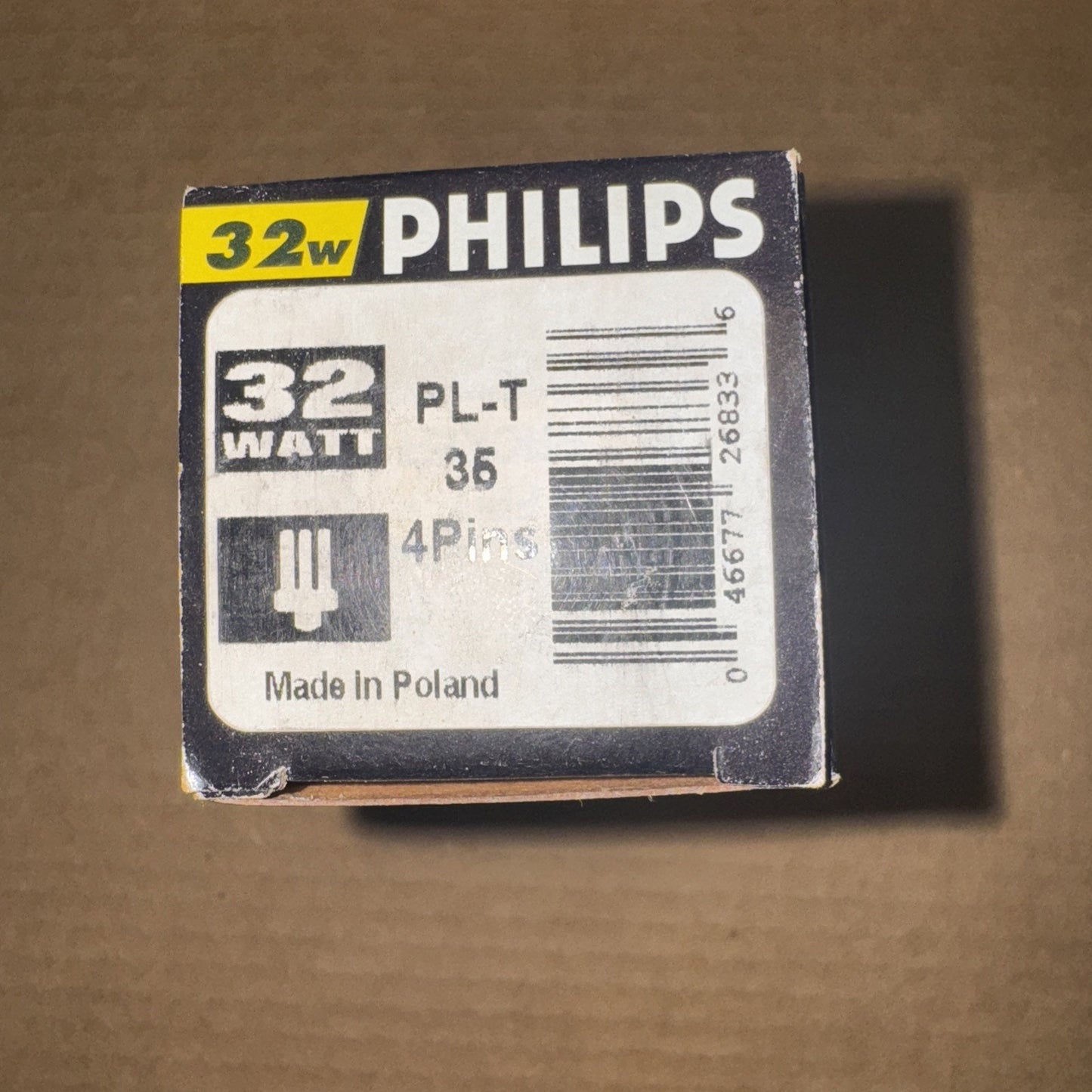 Philips 32W PL-T 35W 4-pin compact fluorescent bulb package with wattage and country of origin label visible