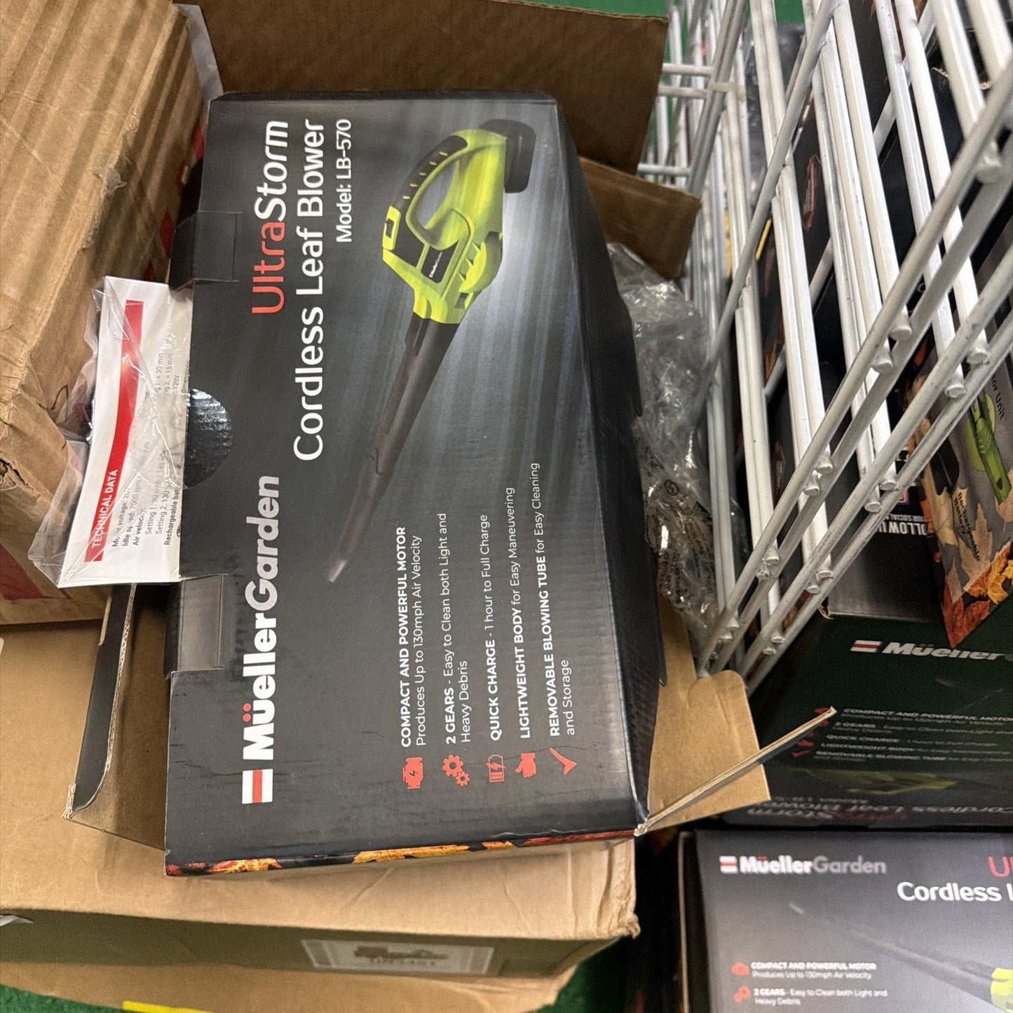 Box packaging for a MuellerGarden UltraStorm cordless leaf blower featuring a compact, lightweight design with a powerful motor and quick charge technology on display.