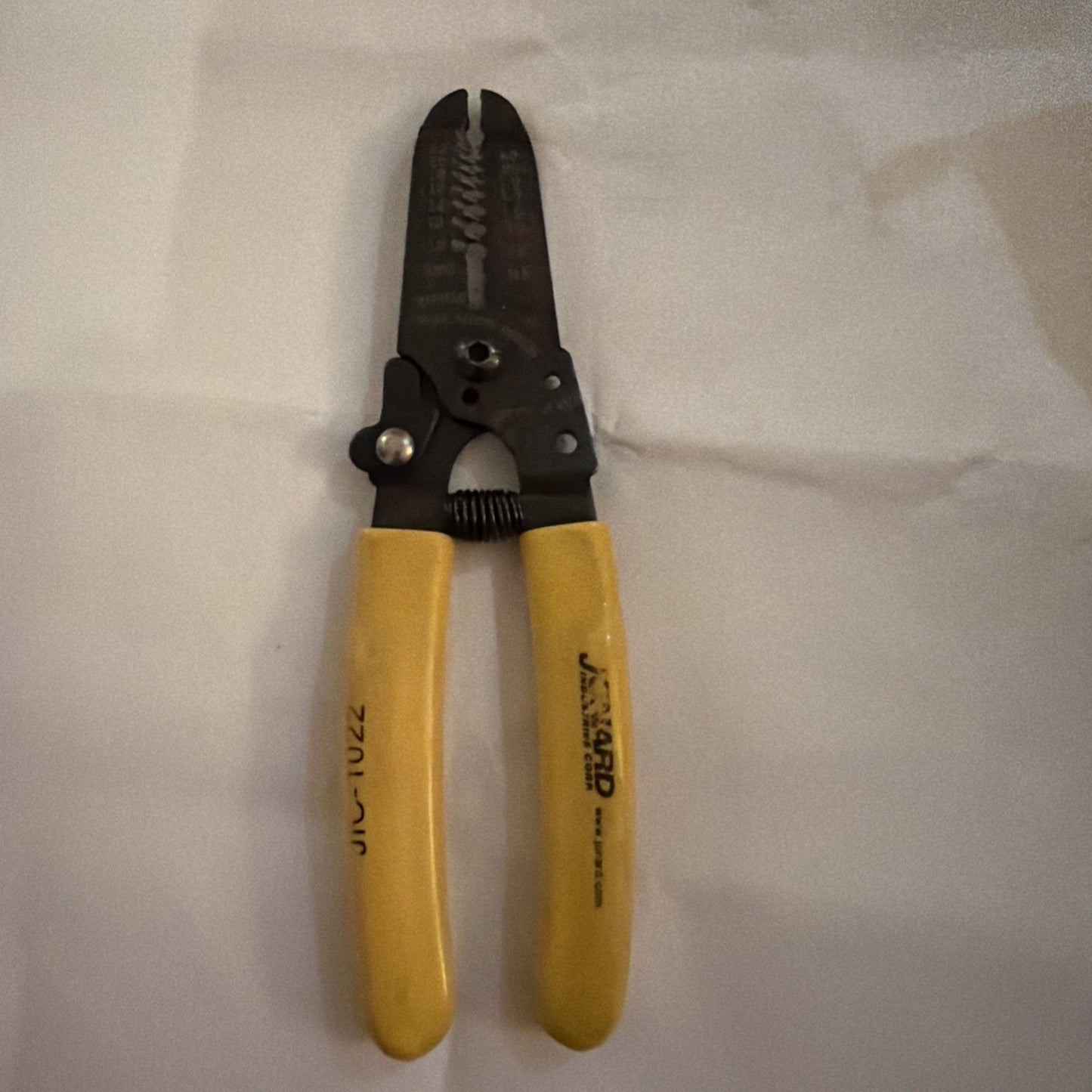 Jonard JIC-1022 wire stripper cutter with yellow handles for 10 to 18 AWG wire, made in USA tool on white background