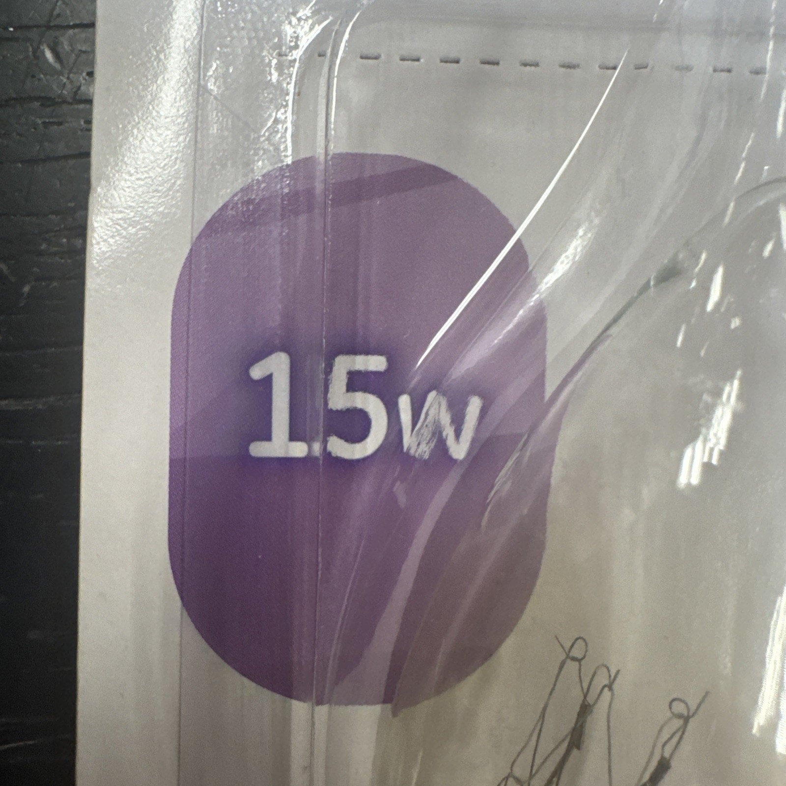 Close-up of packaging showing 15 watt label on GE crystal clear soft white light bulb pack