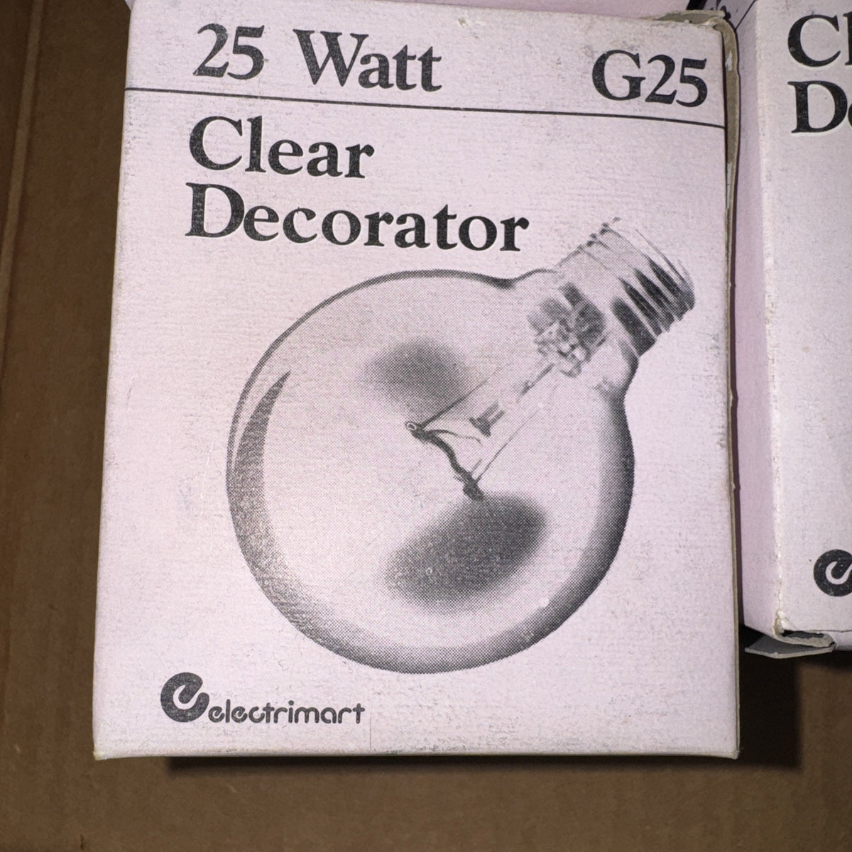 Box packaging of Electrimart clear decorative G25 globe light bulb 25 watt with visible filament and brand logo
