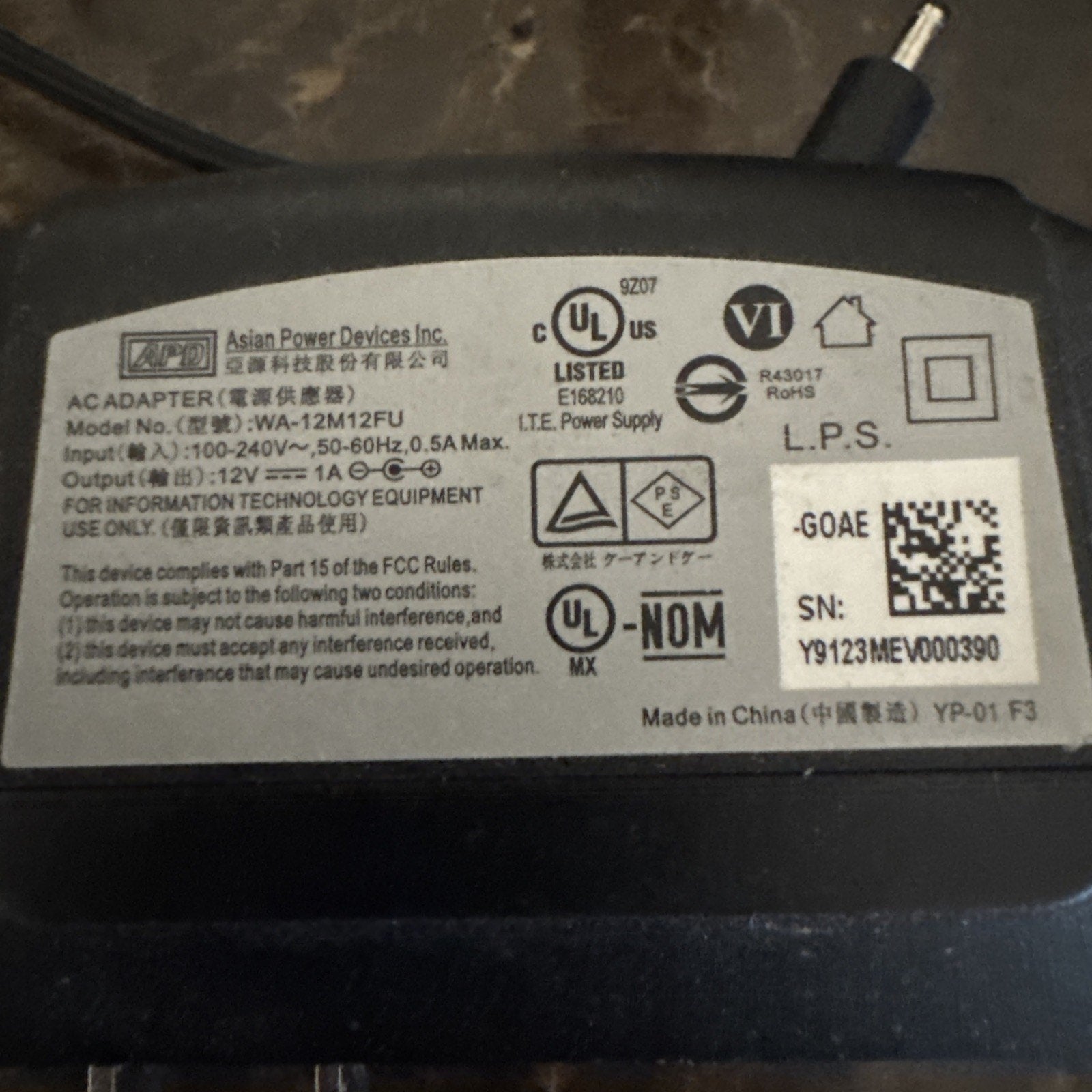 Power supply adapter label for ADT camera model RC8025 showing technical specifications and certifications