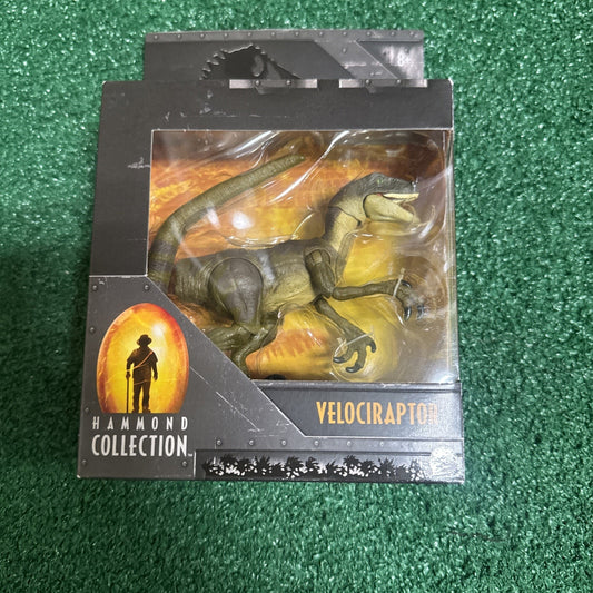 Jurassic Park Velociraptor action figure in Hammond Collection packaging by Mattel showing raptor in window box
