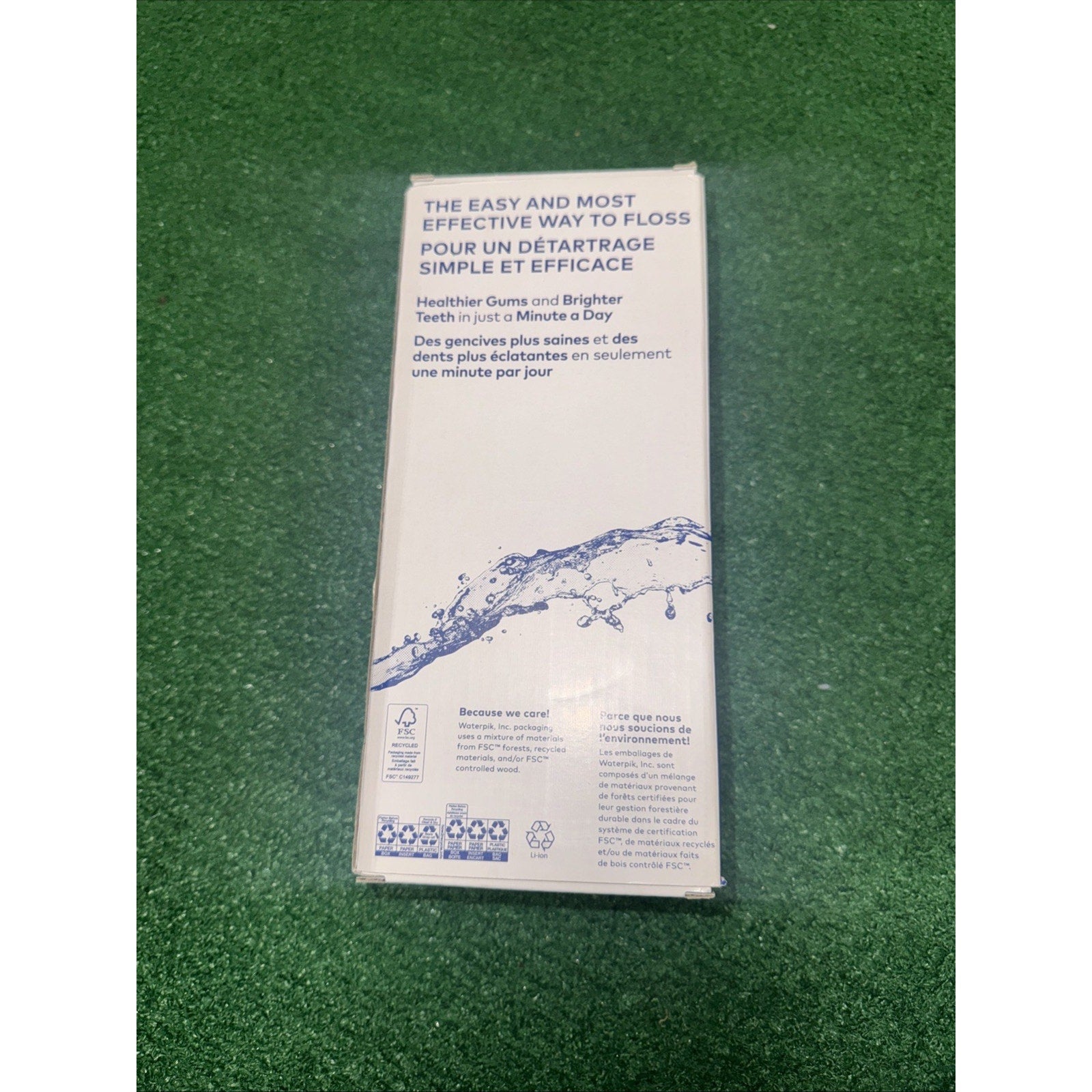 Waterpik Cordless Pulse rechargeable portable water flosser box with product benefits and water splash graphic on back panel