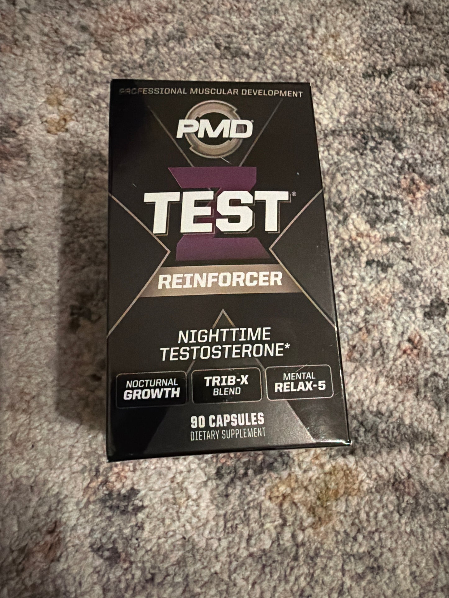 Black rectangular box of dietary supplement capsules labeled for nighttime testosterone support, featuring branding, product name, and key benefits including nocturnal growth and mental relaxation.