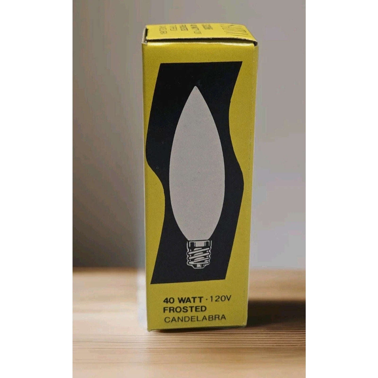 Yellow box of SATCO S3286 40W 120V frosted torpedo candelabra E12 small base light bulbs packaging front view